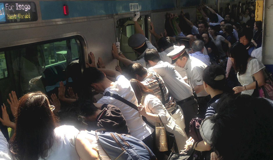 Passengers push train off trapped woman